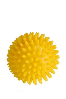 
Yellow massage ball isolated on white.
