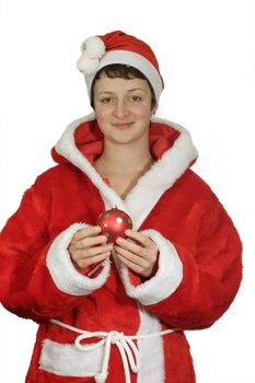 Young santa woman holding a christmas tree ball