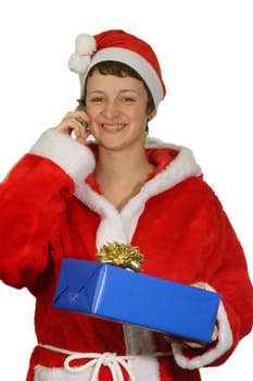 Calling santa girl with blue christmas gift - isolated on white