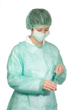 Young female medic with surgical mask - isolated on white