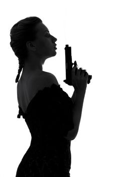 silhouette image of pretty girl with smoking gun