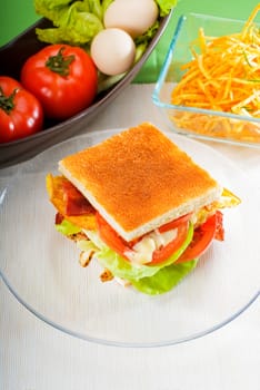 fresh and delicious classic club sandwich over a transparent glass dish