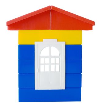 Toy plastic colored house on the white background