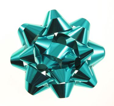An isolated turquoise Christmas gift bow.
