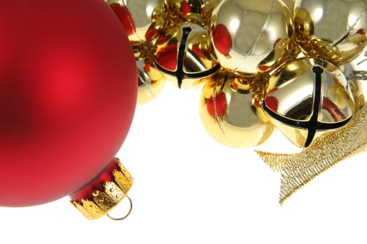 A red bauble and golden bells Christmas ornaments. 