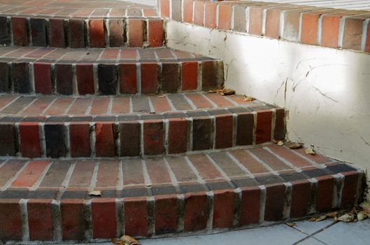 Multi red shaded brick semi-circular brick staircase