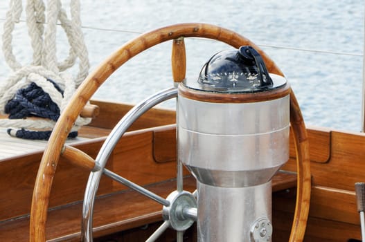 Detail of rudder and compass on a wooden sailboat