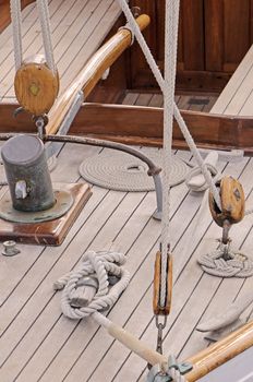 Detail of an old-fashioned sailboat with many tools and ropes