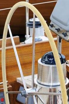 Detail of rudder and compass on a wooden sailboat