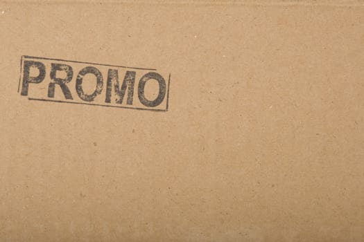promo message, copy-space on brown cardboard texture