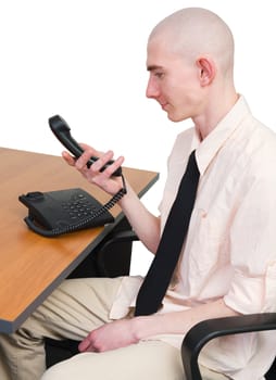 Young man with waiting looks at telephone tube