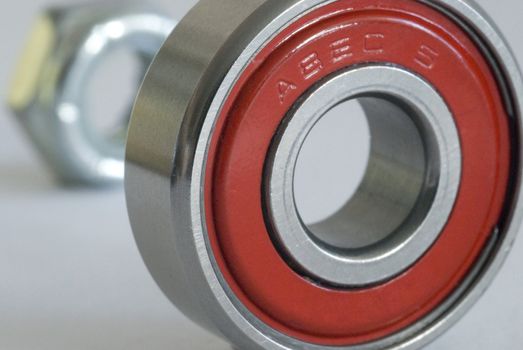 a nut and roller bearing from a skateboard wheel rated at ABEC 5 (Annular Bearing Engineering Committee)