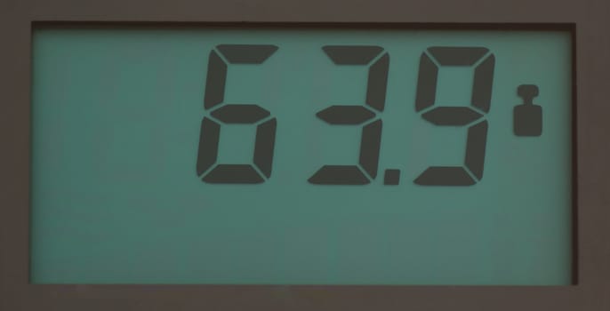 Scale, showing 64.9 kg on LCD display