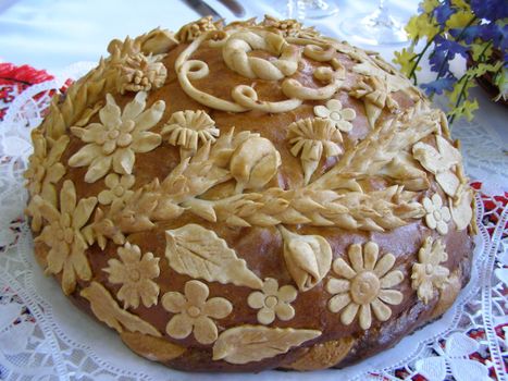 There is Ukrainian round loaf on the table. 