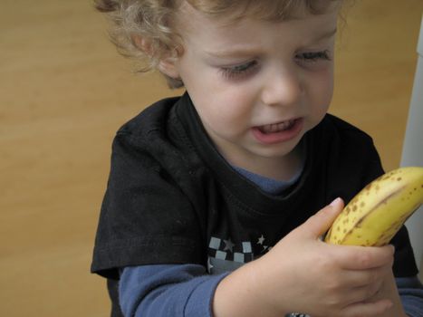 young boy with a banana