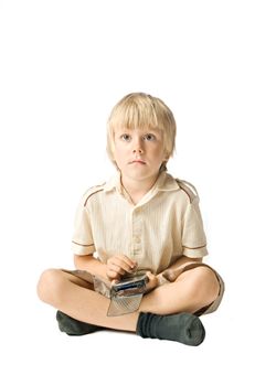 Little boy working with PDA, studio shot