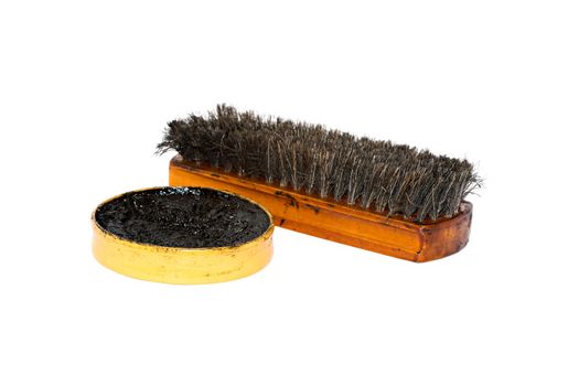 Shoe wax and a brush isolated over white