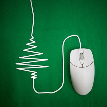 Online christmas shopping concept, mouse on green background with christmas tree