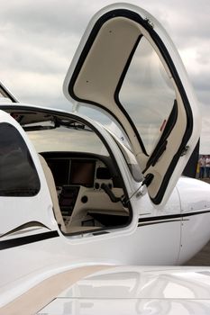 Partial view of airplane cockpit, viewed by open door