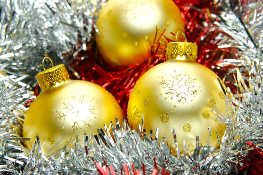 Christmas ornaments isolated on a tinsel