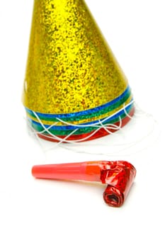 Party hats and blowers isolated against a white background