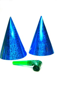 Party hats and blowers isolated against a white background