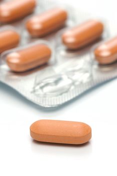 Prescription tablets isolated against a white background