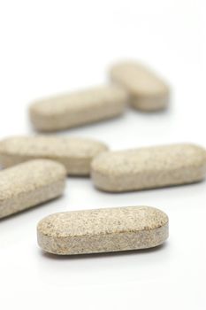 Prescription tablets isolated against a white background