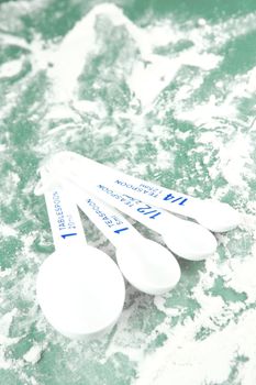 Measuring cups isolated against a green backgroundd