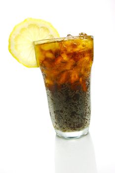 A glass of lemon cola isolated against a white background