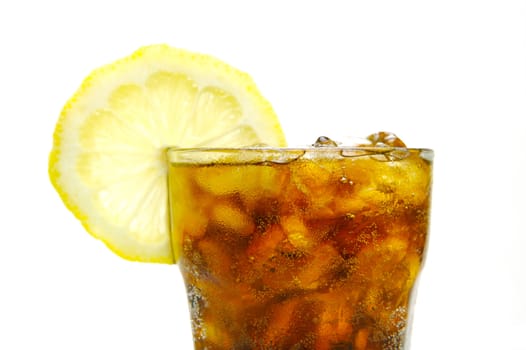 A glass of lemon cola isolated against a white background