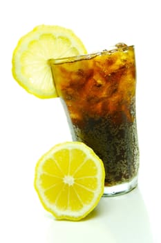 A glass of lemon cola isolated against a white background