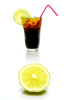 A glass of lemon cola isolated against a white background