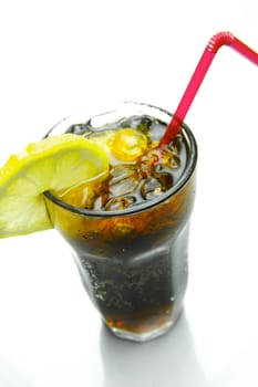 A glass of lemon cola isolated against a white background