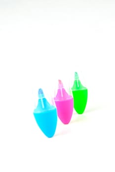 Mini highlighers isolated against a white background