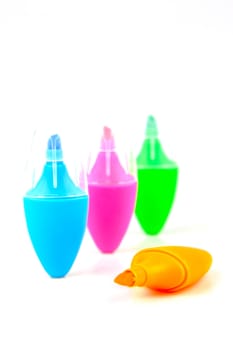 Mini highlighers isolated against a white background