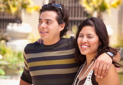 Attractive Hispanic Couple Enjoying Themselves At The Park.