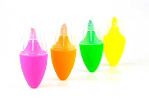 Mini highlighers isolated against a white background