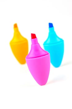 Mini highlighers isolated against a white background