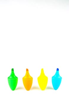 Mini highlighers isolated against a white background