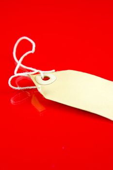 A price tag isolated against a red background