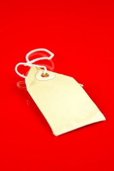 A price tag isolated against a red background