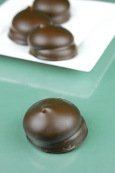 Marshmallow biscuits isolated against a green background