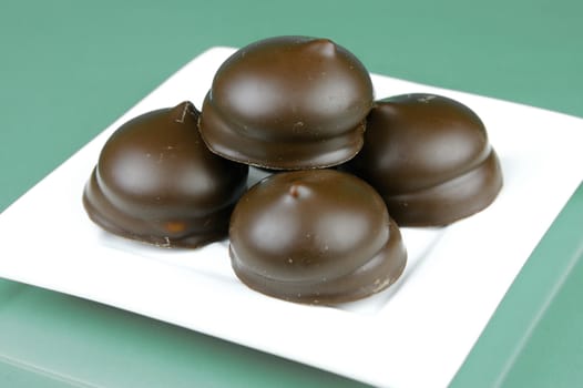 Marshmallow biscuits isolated against a green background