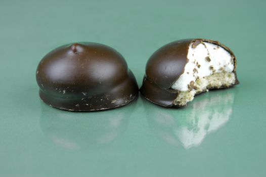 Marshmallow biscuits isolated against a green background