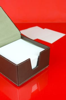 A note block isolated against a red background