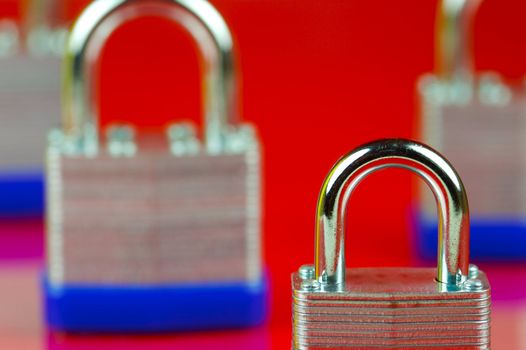 A padlock isolated against a red background