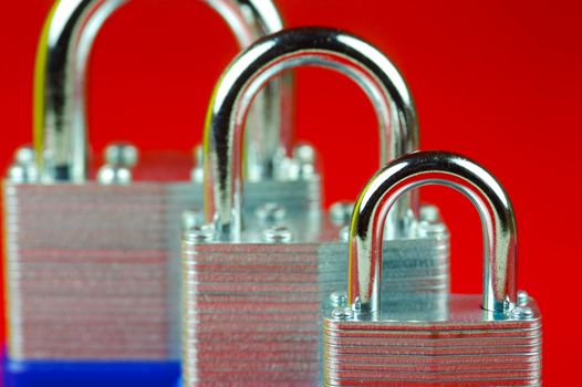 A padlock isolated against a red background