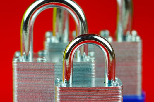 A padlock isolated against a red background