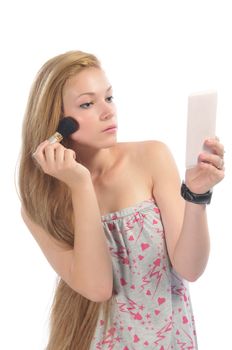 Long-hair blonde applying make-up, isolated on white.